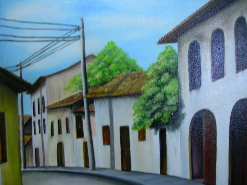 Pintura de rua com casarões brancos e árvores